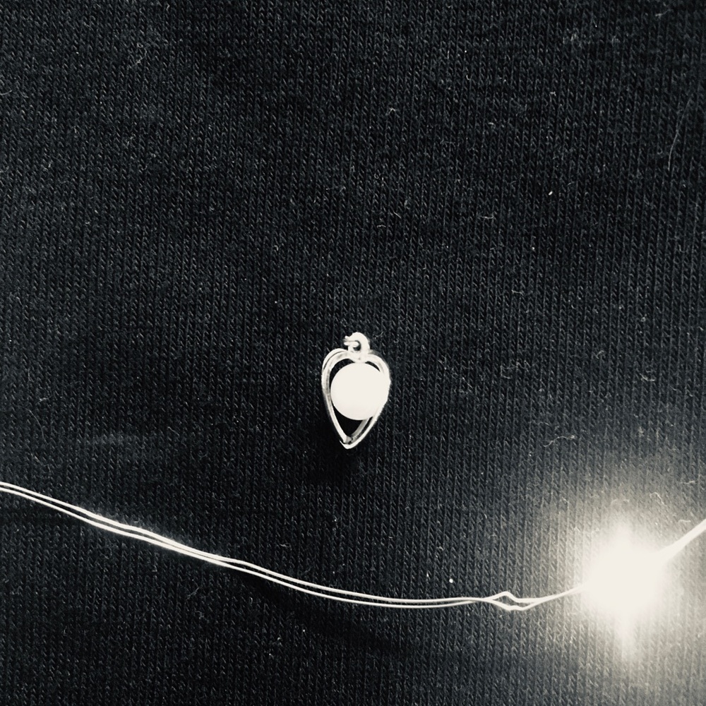 Beautiful pearl in a cage charm!